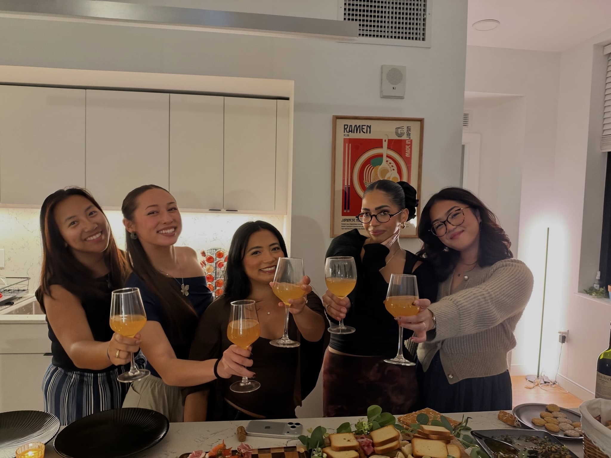 Glasses raised at the kitchen island